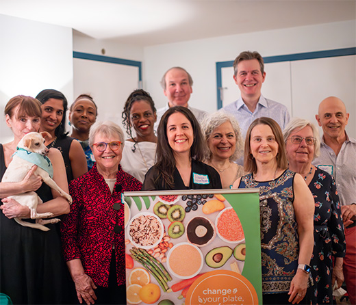 Plant-powered community members at a house party fundraiser in Harlem